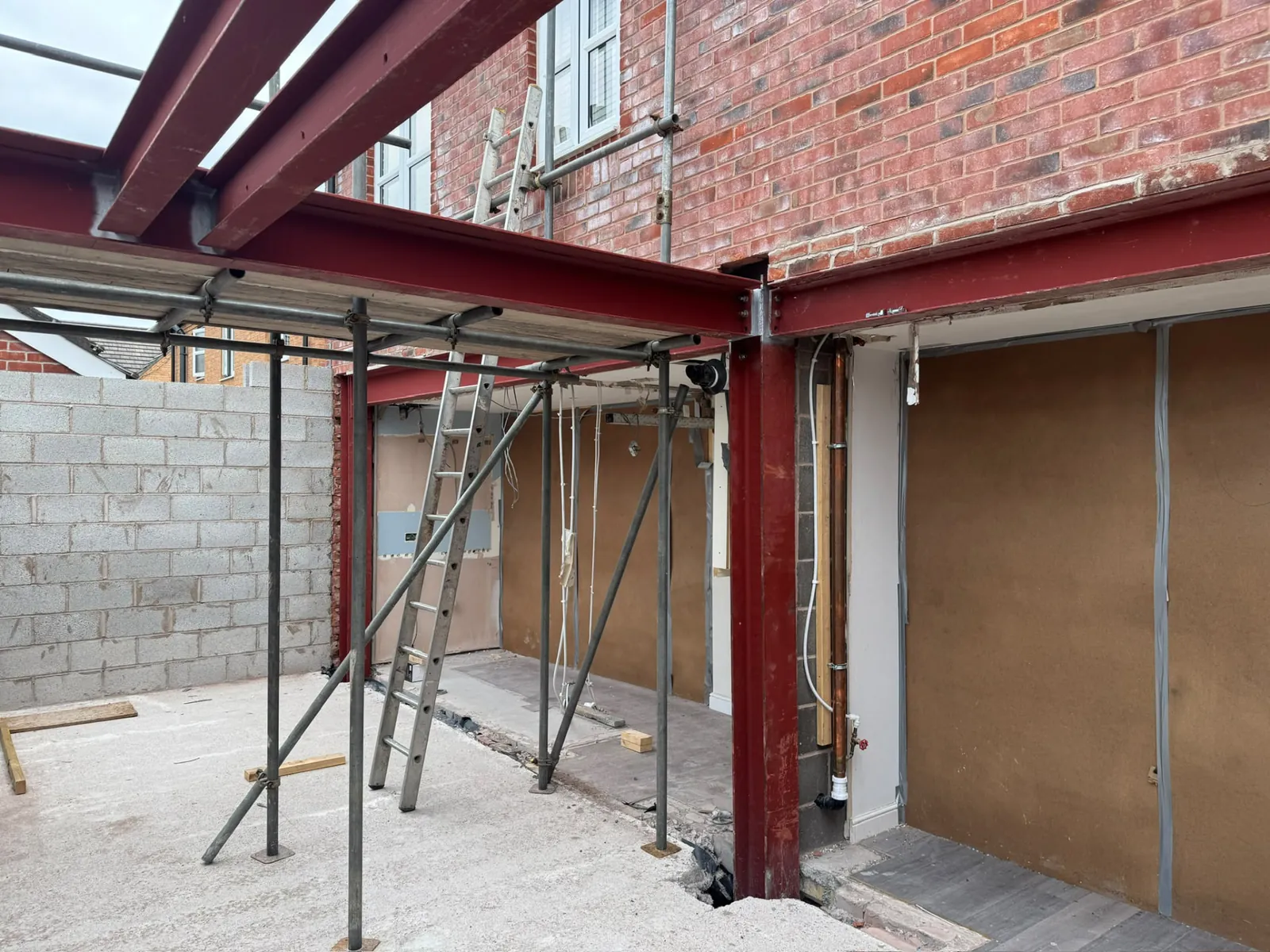 Structural steel beams supporting the opening for a rear house extension
